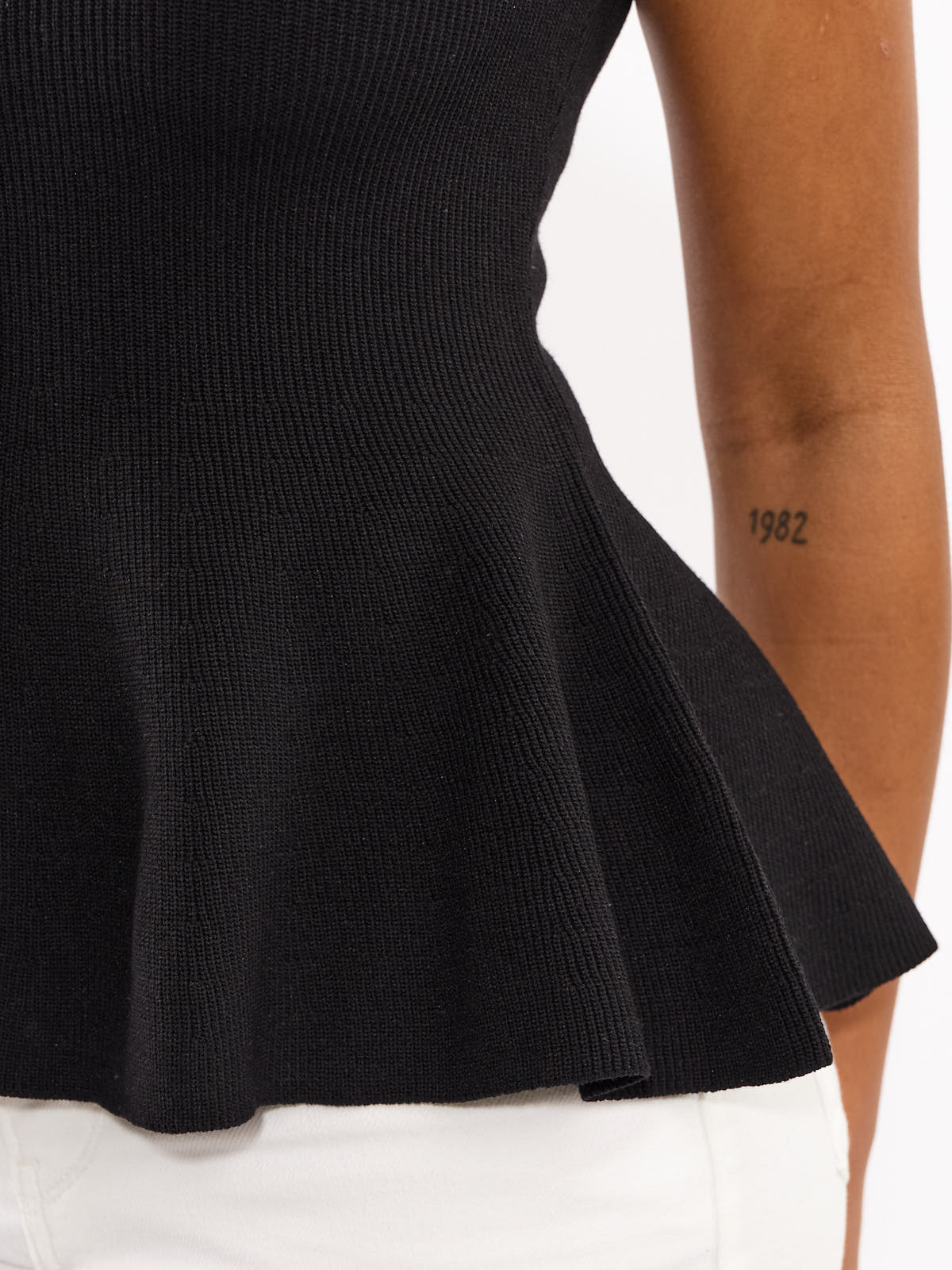 Lucca Button Peplum Sleeveless Knit Top